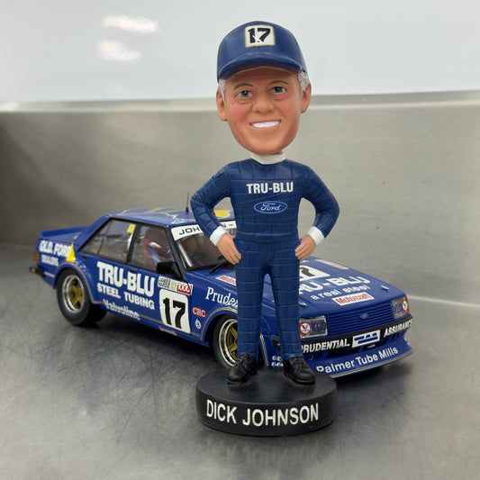 Bobblehead of Dick Johnson in front of a model race car with 'TRU-BLU' branding.