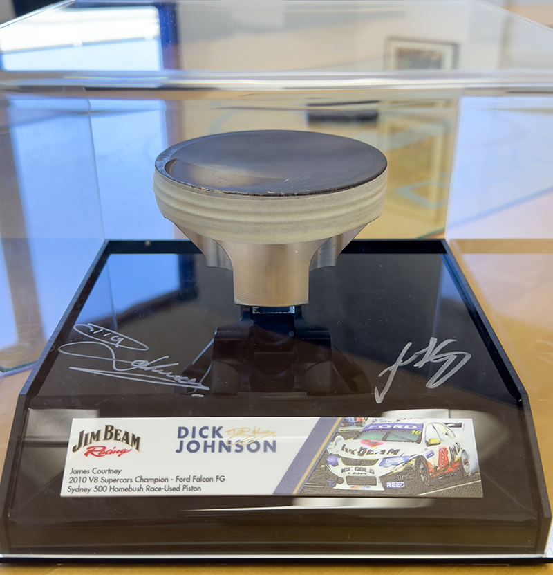 James Courtney 2010 Championship-Winning Falcon FG Piston - signed by Dick Johnson and James Courtney